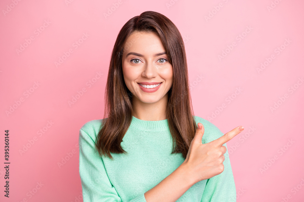 Photo of charming young girl indicate forefinger empty space wear turquoise pullover isolated pink color background Photo of charming young girl indicate forefinger empty space wear turquoise pullover isolated pink color background