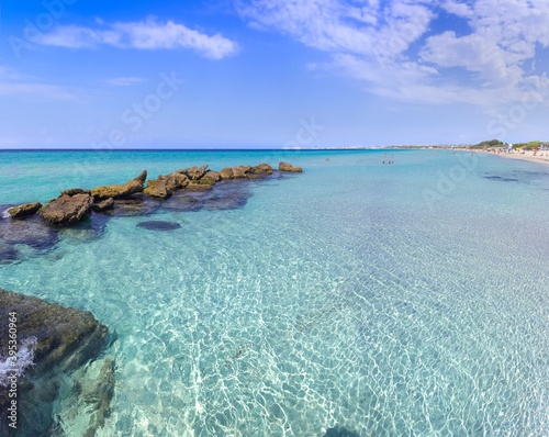 Fototapeta Naklejka Na Ścianę i Meble -  	
Baia Verde Beach in Salento, Apulia (Italy). It's not far away from Gallipoli, stretches along three kilometres with its white and fine sand, surrounded by dunes and emerald green sea.
