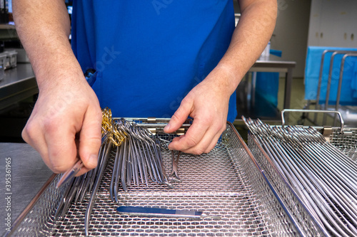 some Cleaned surgical instruments are sorted into an instrument tray