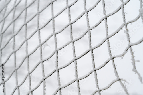 rag net in frost on a white background