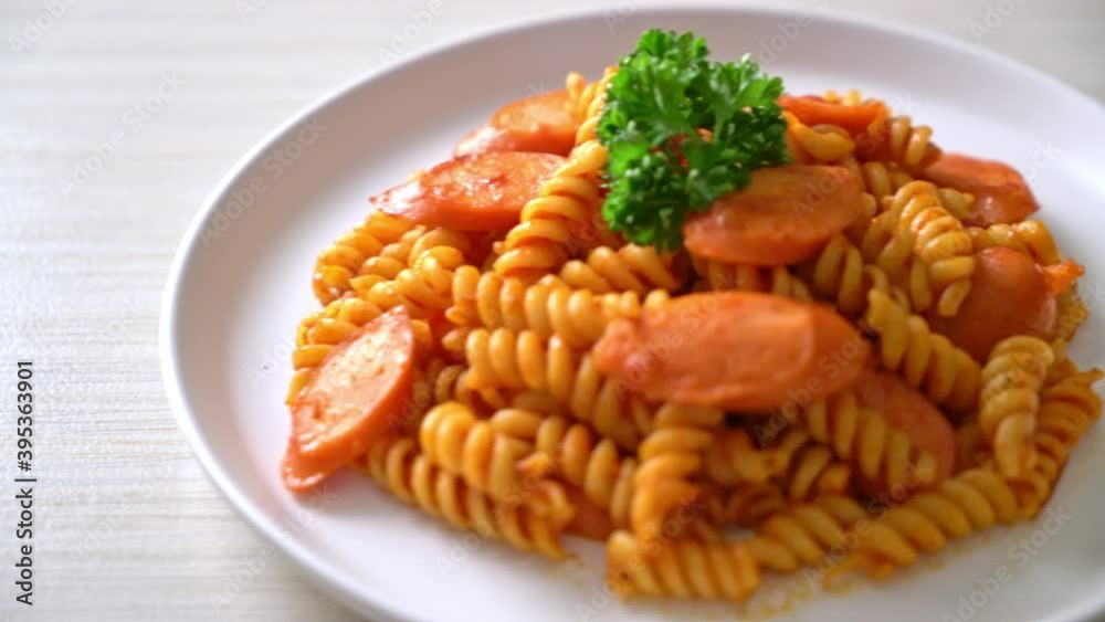 spiral or spirali pasta with tomato sauce and sausage - Italian food style spiral or spirali pasta with tomato sauce and sausage - Italian food style