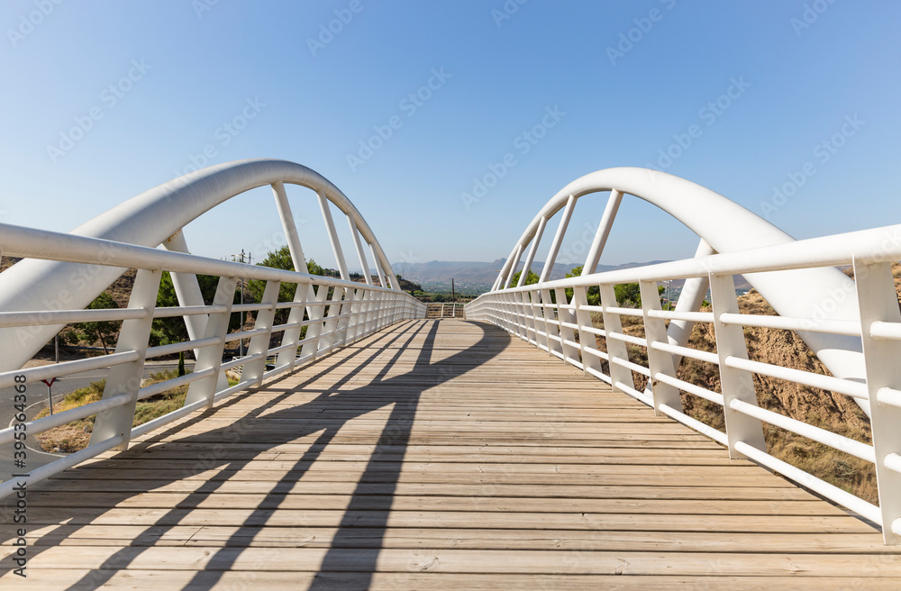 a modern pedestrian bridge over N-IIa road next to Fraga city, province of Huesca, Aragon, Spain a modern pedestrian bridge over N-IIa road next to Fraga city, province of Huesca, Aragon, Spain