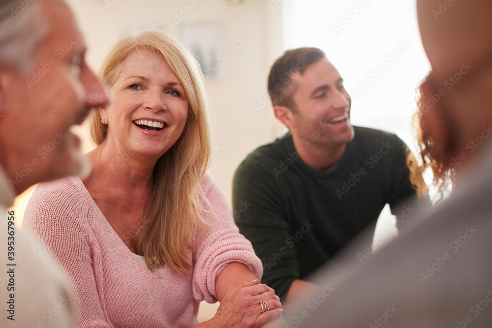 Fototapeta premium People Attending Support Group Meeting For Mental Health Or Dependency Issues In Community Space