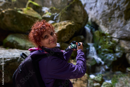 Tourist woman hiking in the mountains