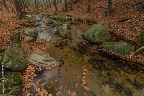 Maly Bily Stolpich waterfall in autumn fresh morning in Jizerske mountains photo