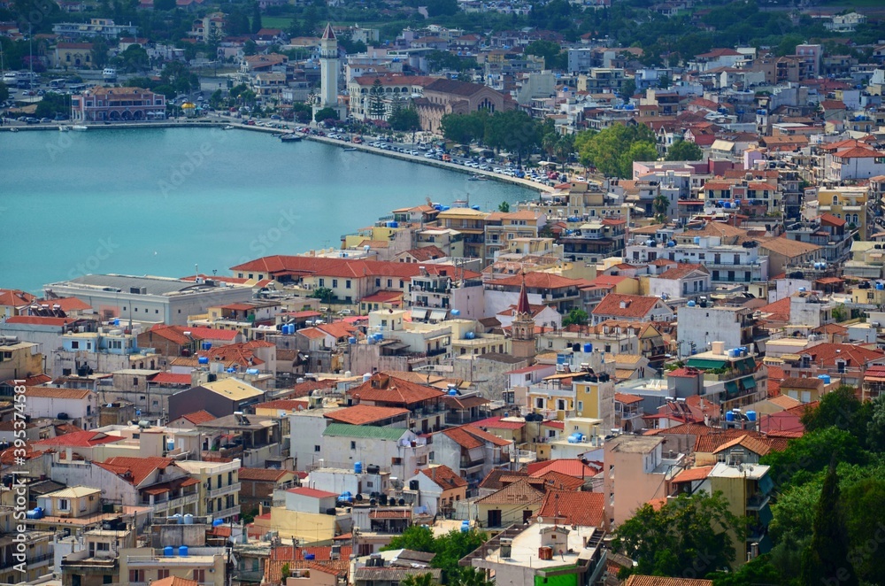 View of Zante, the capital of Zakynthos, Greece. Detail on the multicolored roofs of houses in the city and on the bay in the harbor.