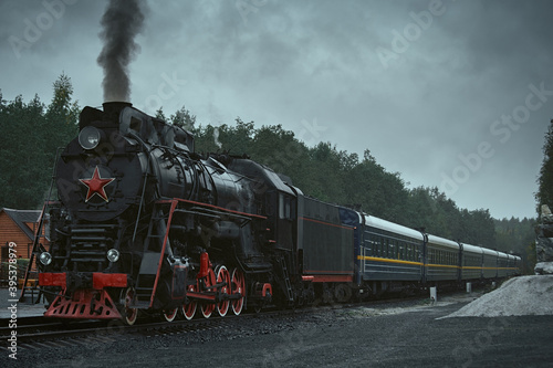 Fototapeta Naklejka Na Ścianę i Meble -  Old retro vintage steam train on platform station Ruskeala Park