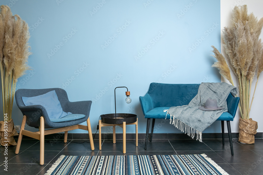 turquoise sofa and chair, classic living room decoration, blue wall, carpet  on dark wooden floor, interior style Stock Photo | Adobe Stock