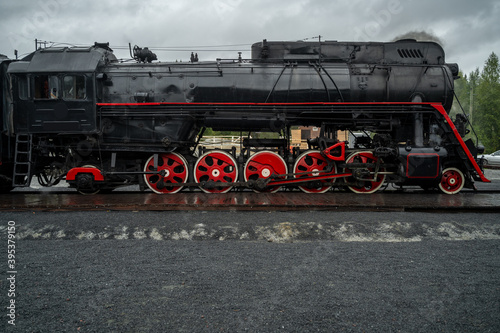 Old retro vintage steam train on platform station Ruskeala Park