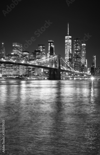 Black and white night view of Manhattan waterfront  New York City  USA.