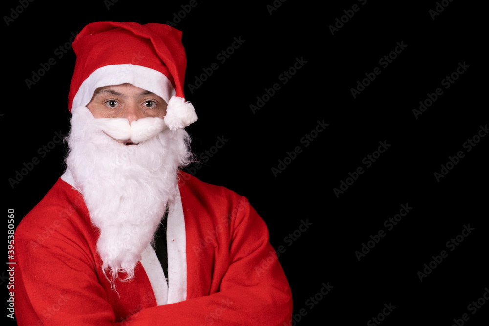 man with down syndrome dressed as santa claus on black background man with down syndrome dressed as santa claus on black background
