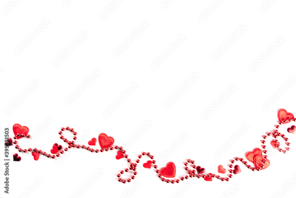 Saint Valentine's day greeting card, border of holiday symbols, on white background. Various red hearts and red beads, above Saint Valentine's day greeting card, border of holiday symbols, on white background. Various red hearts and red beads, above