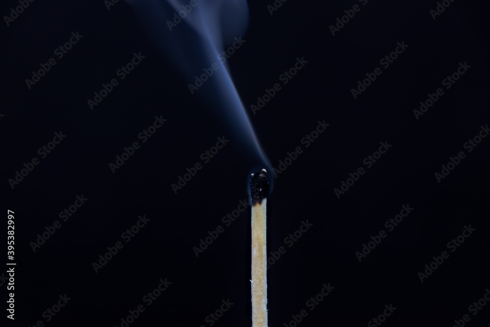 Single matchstick extinguished isolated on black background Single matchstick extinguished isolated on black background