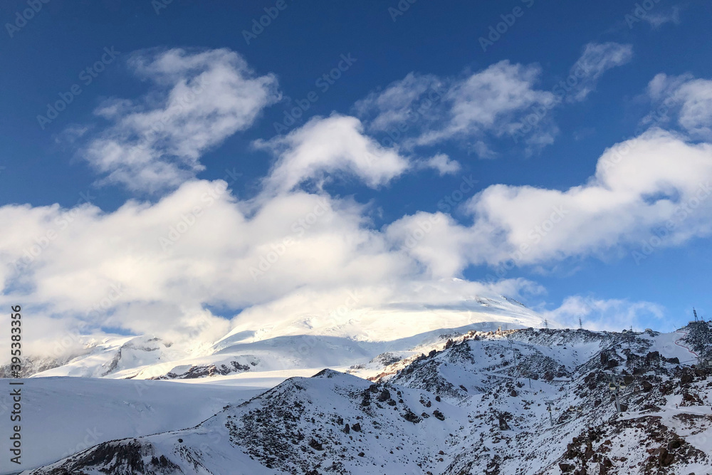 elbrus peaks hidden by the white clouds, winter shot. The highest point in europe
