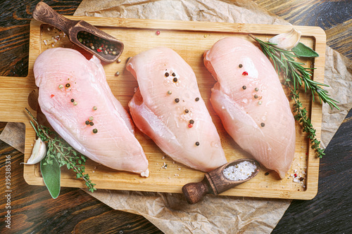 Obraz na płótnie fresh raw farm chicken fillet on a cutting board. w salonie