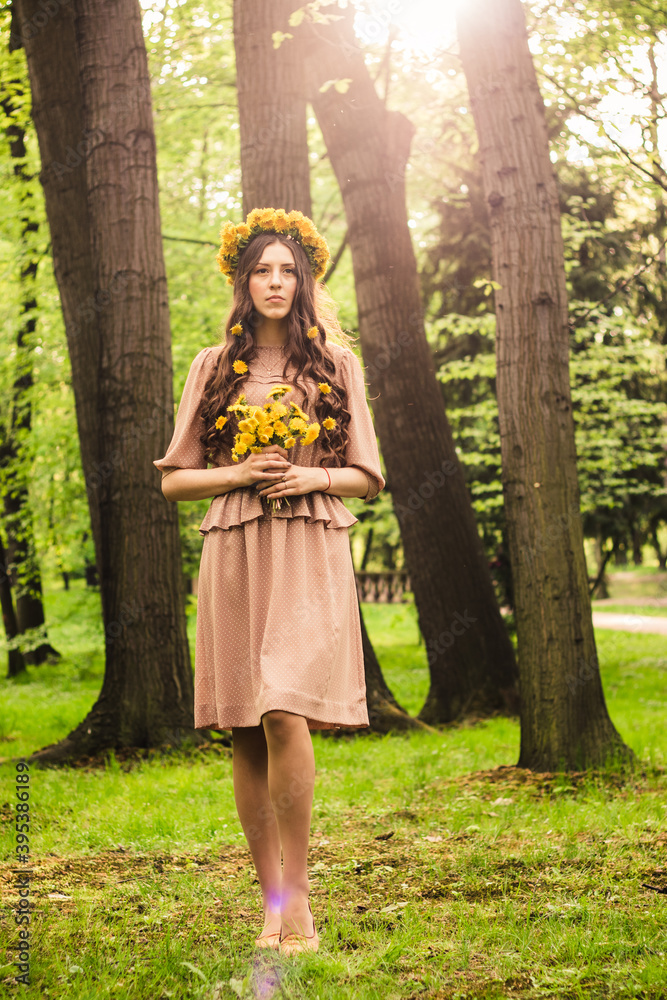 Fashion Summer Model Girl with Long Blowing Hair. Summer Beautiful Woman with Healthy and Beauty Brown Hair with Green Grass on Sunny Background Fashion Summer Model Girl with Long Blowing Hair. Summer Beautiful Woman with Healthy and Beauty Brown Hair with Green Grass on Sunny Background