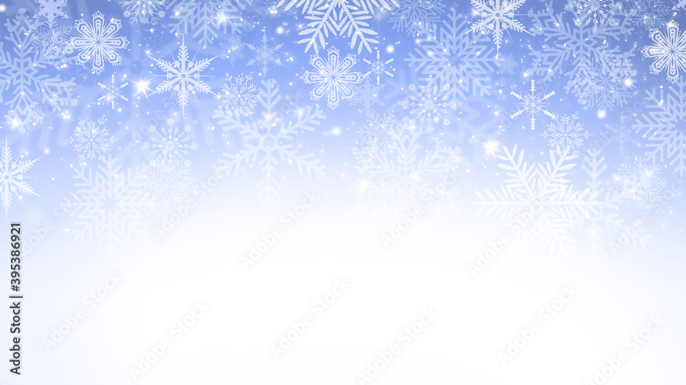 Winter blue and white gradient bokeh background with snowflakes and sparkles Winter blue and white gradient bokeh background with snowflakes and sparkles
