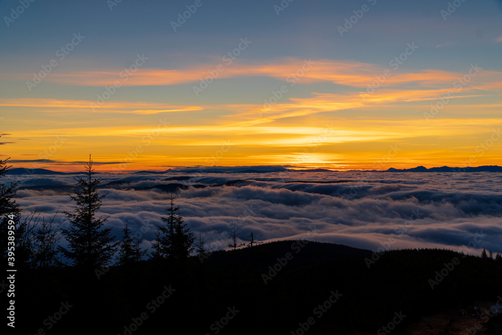 Early dawn. The rising of the sun above the clouds. Expectation of the sun. Beskydy , Czech Republic.