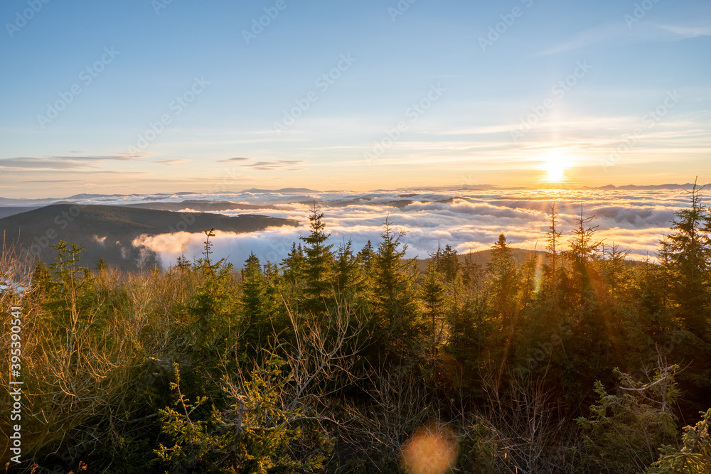 Inversion in the valley during sunrise with mountain ridge in the background, Beskydy , Czech Republic. Inversion in the valley during sunrise with mountain ridge in the background, Beskydy , Czech Republic.
