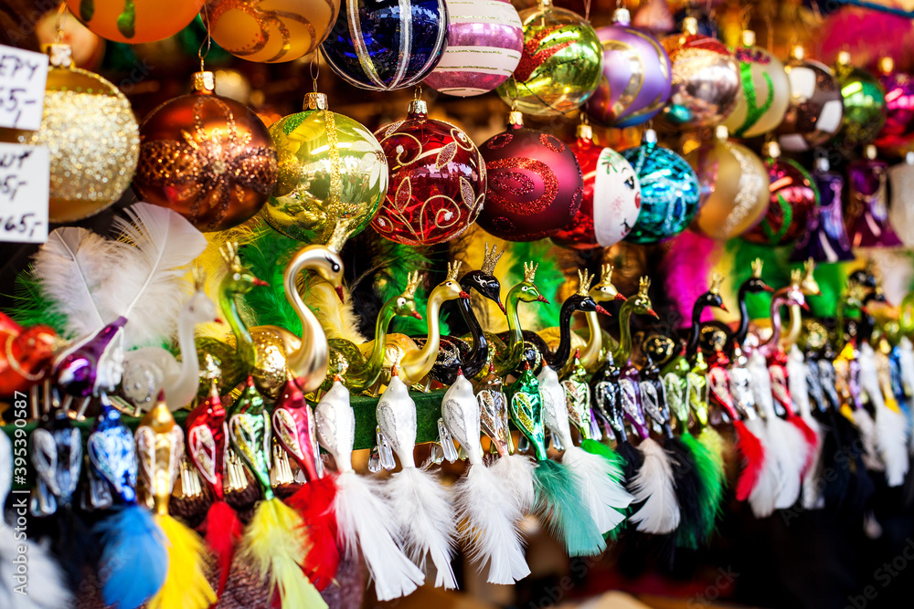 Close up of colored balls and glass birds at Christmas market