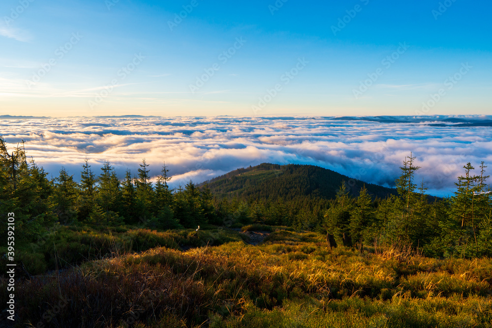 Inversion in the valley during sunrise with mountain ridge in the background, Beskydy , Czech Republic.