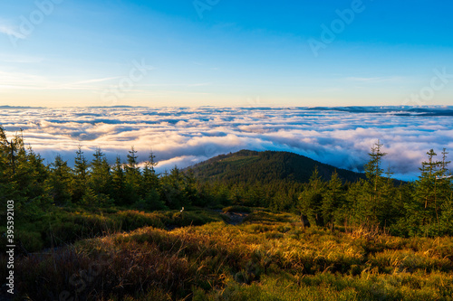 Inversion in the valley during sunrise with mountain ridge in the background  Beskydy   Czech Republic.