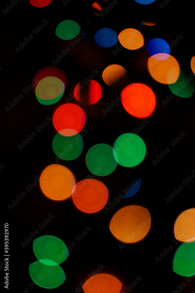 Colorful bokeh banner. Blurry lights. Festive abstract wallpaper. Vertical orientation Colorful bokeh banner. Blurry lights. Festive abstract wallpaper. Vertical orientation