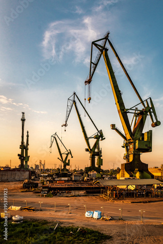 port cranes on sunset