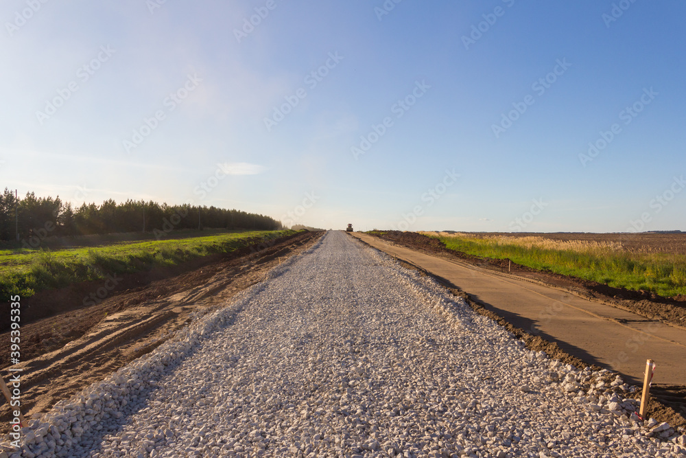 Construction of a new road. One of the gravel layers when paving new asphalt. Highway construction technology