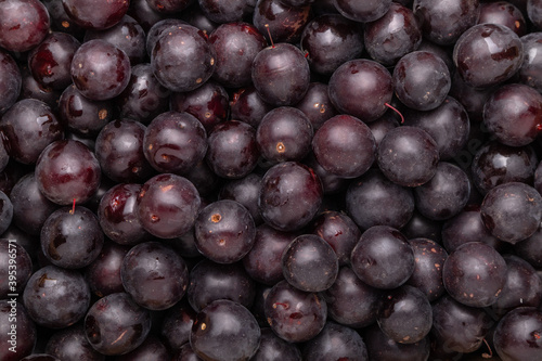 black plums top view background