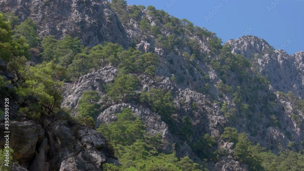 Beautiful mountain cliffs with blue sky in the background. Picturesque nature landscape. Beautiful mountain cliffs with blue sky in the background. Picturesque nature landscape.