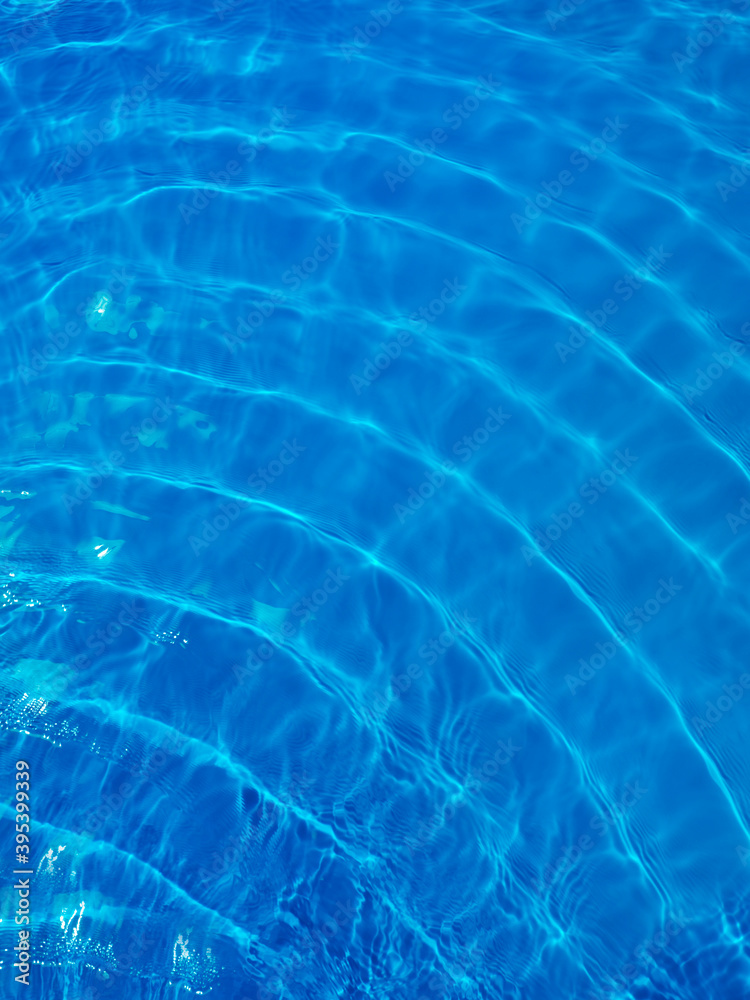 Rippled blue water in swimming pool view from above