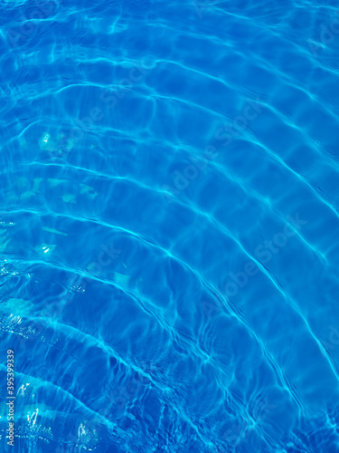 Rippled blue water in swimming pool view from above
