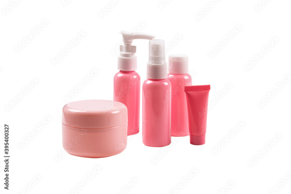 Pink plastic bottles for hygiene products, cosmetics, hygiene products on a white background. Copy space. Pink plastic bottles for hygiene products, cosmetics, hygiene products on a white background. Copy space.