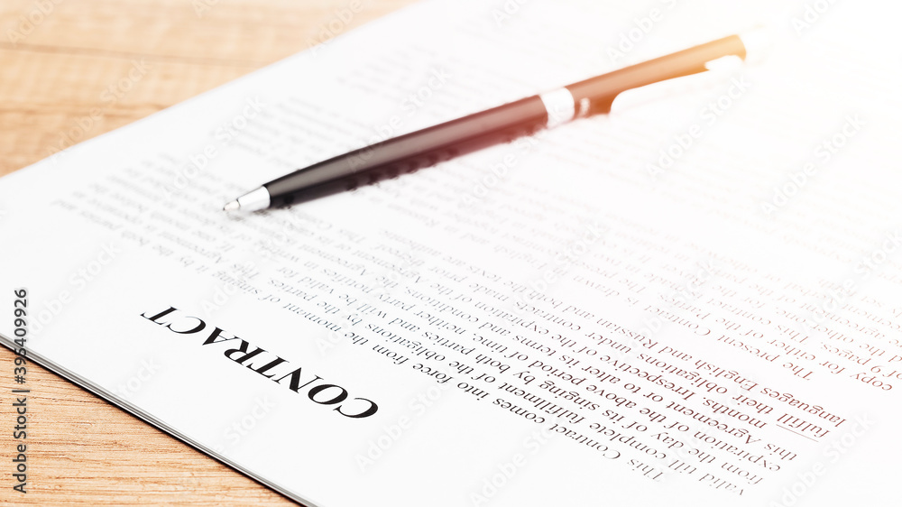 Pen lying on a contract or application form. Close up. Pen lying on a contract or application form. Close up.