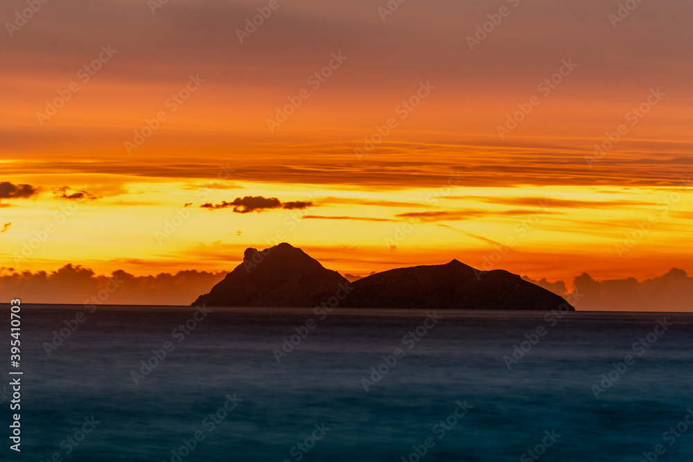 Sunset over Paximadia, two uninhabited islands in the gulf of Mesara in the Libyan Sea next to the southern coast of Crete, Greece