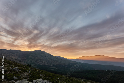 Fototapeta Naklejka Na Ścianę i Meble -  Sunset over Pico de Peñalara and the Lozoya Valley from Puerto de la Morcuera in the Sierra de Guadarrama National Park. Madrid's community. Spain