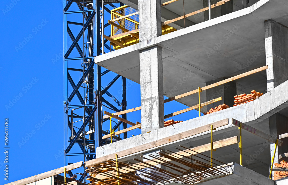 Fototapeta premium Crane and highrise construction site
