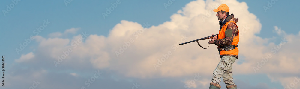 Silhouette of a hunter with a gun against the sun, an ambush for ducks. Silhouette of a hunter with a gun against the sun, an ambush for ducks.