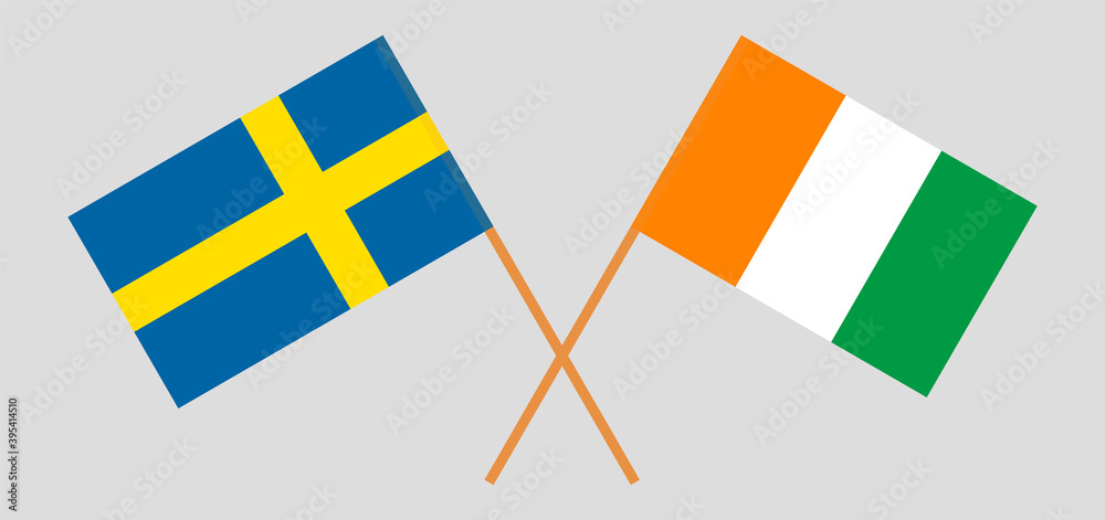 Crossed flags of Sweden and Republic of Ivory Coast