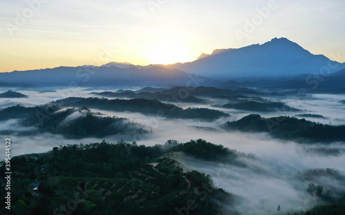 Beautiful Landscape of misty foggy with mount kinabalu during sunrise © Mohd Khairil