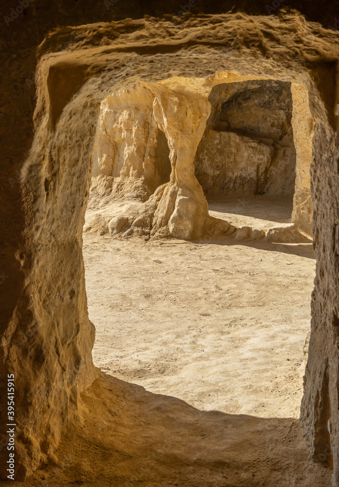 Stunning Roman catacombs carved on the sandstone cliffs above the Matala Beach, Crete, Greece. In Roman times, the dead were buried in them, later they were used by the first Christians