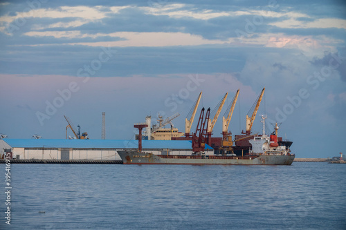 Tripoli, Libya - November 25, 2020: Container ships with loading cranes in the Port of Tripoli