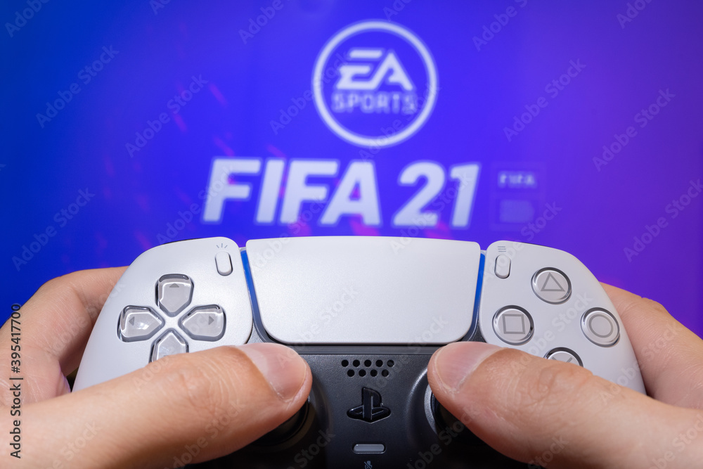 Man play FIFA 21 with Playstation 5 Dual Sense - 25th November, 2020, Sao  Paulo, Brazil. Stock Photo | Adobe Stock