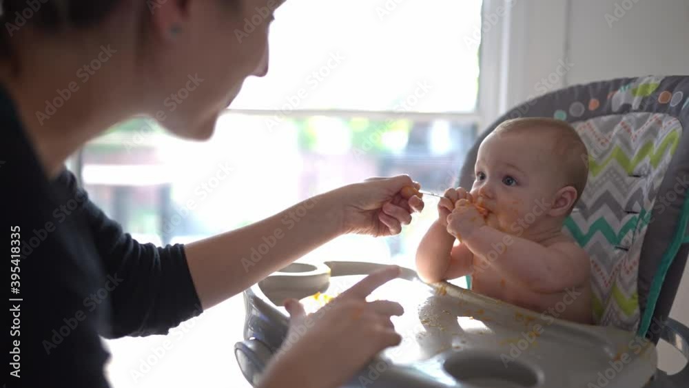 A happy little cute daughter with mash food everywhere A happy little cute daughter with mash food everywhere