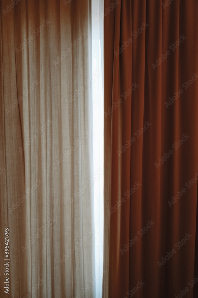 Beige and brown curtains. Minimalistic interior