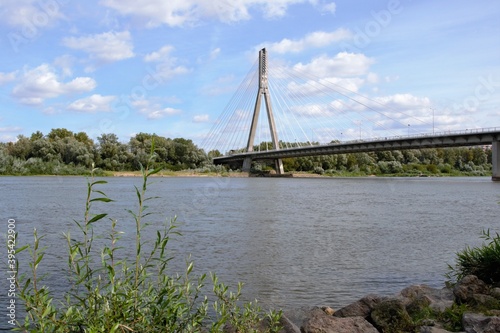 Swietokrzyski Bridge over Vistula river, Warsaw, Poland. Modern, cable-stayed bridge with single tower and cables attached supporting the deck. 