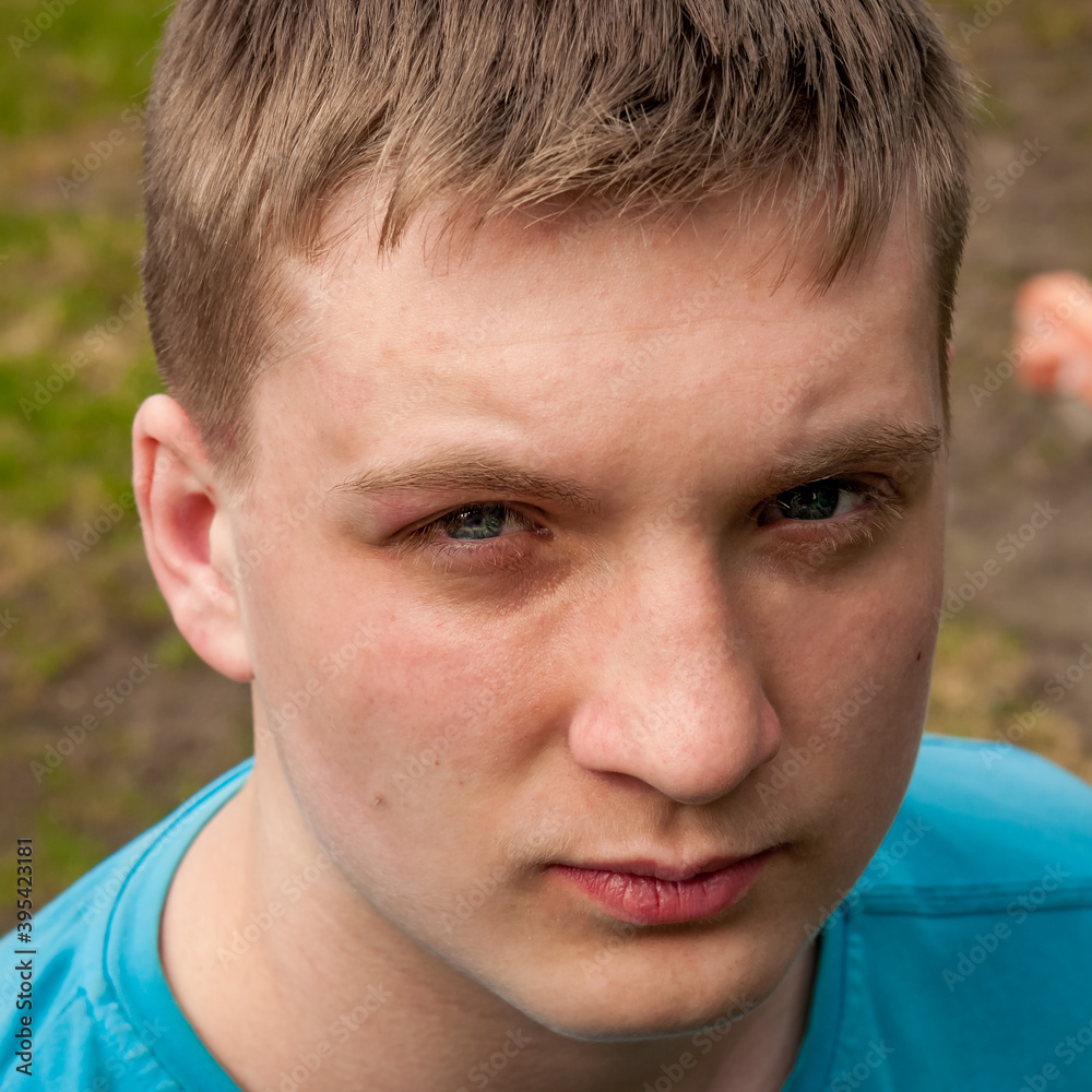 Portrait of a young man with blue eyes.