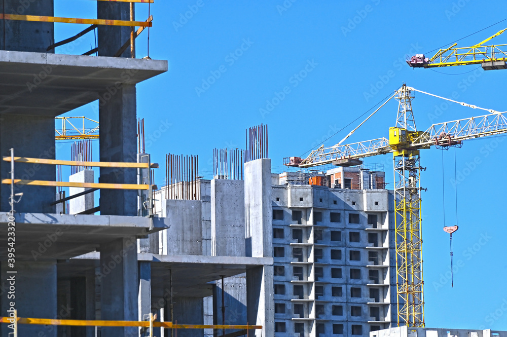 Fototapeta premium Crane and highrise construction site