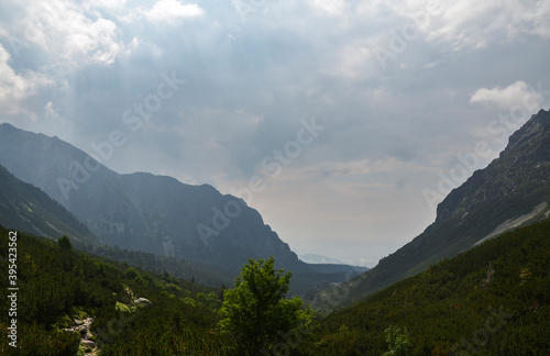 Scenic view Of landscape and rocky foggy mountains against cloudy sky in High Tatras  Slovakia